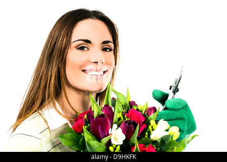 Gartenarbeit. Arbeitnehmerin mit Blumen. Isoliert auf weißem Hintergrund Stockfoto