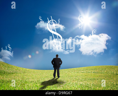 Dollar-Zeichen in den Himmel blickte Geschäftsmann Stockfoto