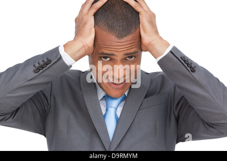 Erschöpften Geschäftsmann hielt seinen Kopf zwischen den Händen Stockfoto