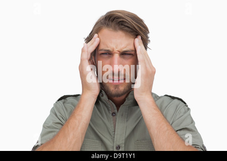 Mann mit Schmerzen von Kopfschmerzen Grimassieren Stockfoto