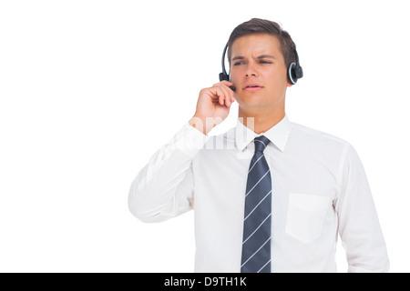 Callcenter-Agent arbeitet mit Kopfhörer Stockfoto