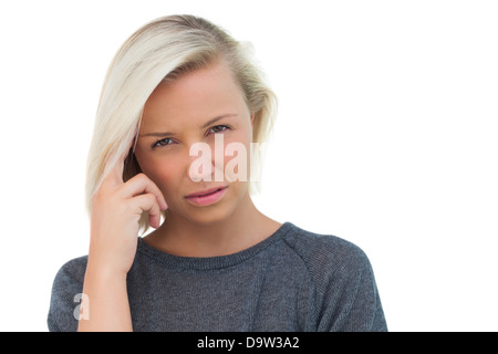 Blonde Frau mit Kopfschmerzen leiden Stockfoto