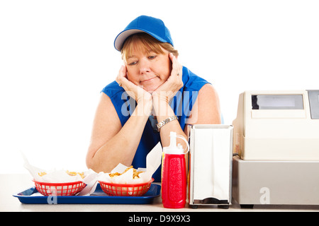 Reife Erwachsene Fastfood Arbeiter langweilen mit ihrem Job. Isoliert auf weiss. Stockfoto