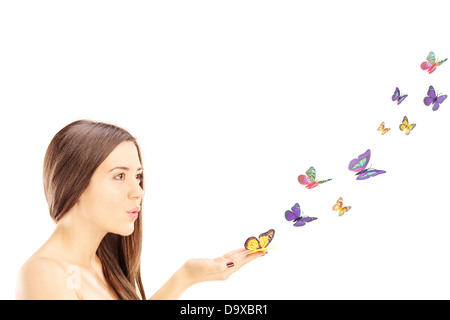 Schöne junge Frau mit vielen bunten Schmetterlingen Stockfoto