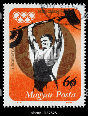 Briefmarke gedruckt in Ungarn, Gewichtheben und Gold-Medaille, Serie ungarischen Medaillengewinner, Olympische Spiele, circa 1973 zeigt Stockfoto