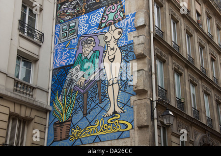 Parisian Straßenkunst. La Femme, la Lumière de l ' Homme, Frau ist das Licht des Mannes. Ein Wandgemälde von Robert Combas, im Marais Viertel von Paris. Frankreich. Stockfoto