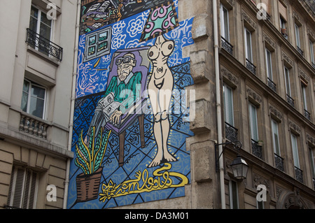 Parisian Straßenkunst. La Femme, la Lumière de l ' Homme, Frau ist das Licht des Mannes. Ein Wandgemälde von Robert Combas, im Marais Viertel von Paris. Frankreich. Stockfoto