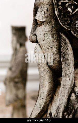 Chinesischen Statuen im Wat Pho, Bangkok. Stockfoto