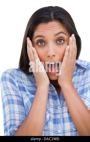 Erstaunt junge Frau Blick in die Kamera mit Hände am Kopf Stockfoto