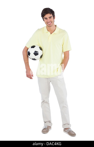 Lächelnder Mann mit Soccer ball Stockfoto