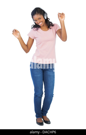 Junge Frau anhören von Musik und Tanz Stockfoto