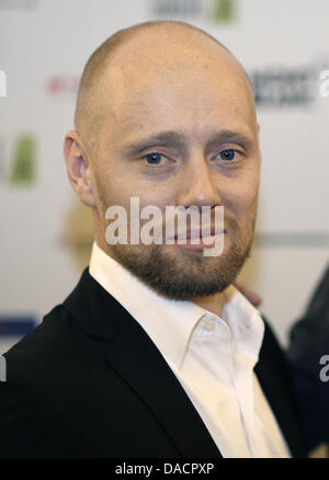 Norwegischer Schauspieler Aksel Hennie kommt für die Premiere des Films "Headhunter" während der Filmfestspiele Hamburg 2011 in Hamburg, Deutschland, 30. September 2011. Foto: Georg Wendt Stockfoto