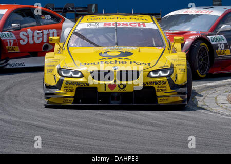 Nürnberg, Deutschland. 14. Juli 2013. Deutschlands-DTM-Rennfahrer-Pilot Timo Glock (Team MTEK) treibt seine BMW M3 im fünften Rennen der Saison der Deutschen Tourenwagen Masters (DTM) auf dem Norisring in Nürnberg, 14. Juli 2013. Foto: DAVID EBENER/Dpa/Alamy Live News Stockfoto