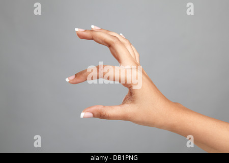 Frauenhand Geste halten Stockfoto