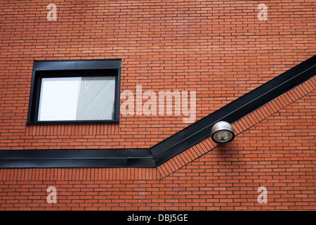 Laterne an der roten Ziegel Wand Stockfoto