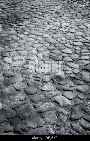 Closeup Hintergrundtextur nass der alten gepflasterten Straße Stockfoto