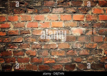 Alte Ziegel Wand Hintergrund mit vignette Stockfoto