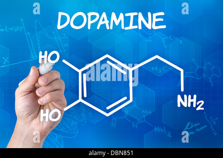 Hand mit Federzeichnung die chemische Formel von Dopamin Stockfoto
