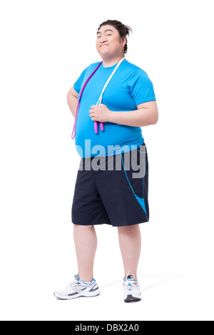 Glücklich dicker Mann mit Springseil Stockfoto