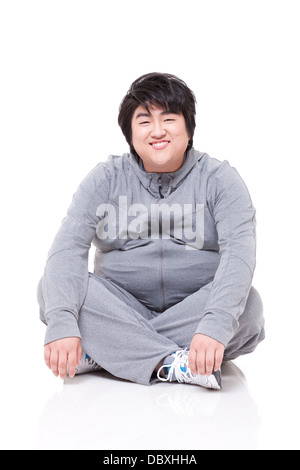 Fröhliche übergewichtiger Mann am Boden Stockfoto