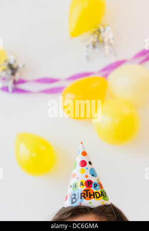 Partyhut und Luftballons Stockfoto