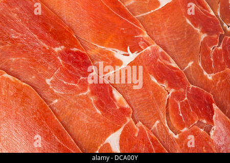 Spanischer Jamon Iberico in Scheiben geschnitten, Hintergrund Stockfoto