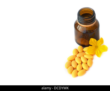 Kapseln Tabletten Bio Medizin und Flasche mit Blume isoliert auf weißem Hintergrund Stockfoto