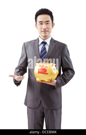Geschäftsleute und Sparschwein Stockfoto
