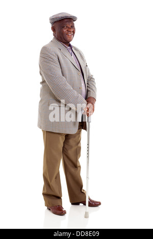 lächelnd älteren afrikanischen Mann mit Spazierstock, isoliert auf weiss Stockfoto