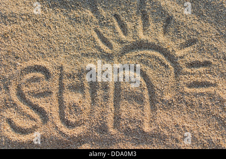 Text-Sonne geprägt im Sand am Strand Stockfoto