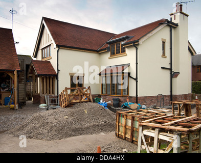 Selbstbau-Haus, hart Landschaftsbau, Paletten aus Sandstein Pflastersteine Rand neu gebaute Immobilie Stockfoto