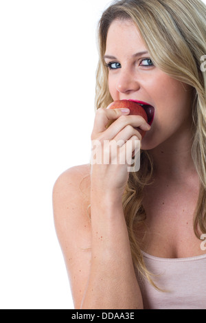 -Modell veröffentlicht. Attraktive junge Frau hält einen Apfel Stockfoto