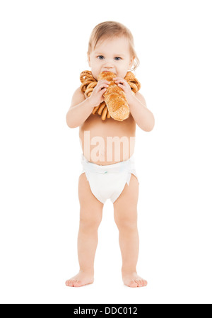 niedliche Todler lange Brot essen Stockfoto