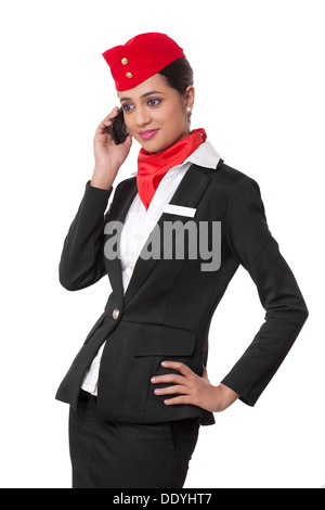 Junge Stewardess mit Handy isoliert auf weißem Hintergrund Stockfoto