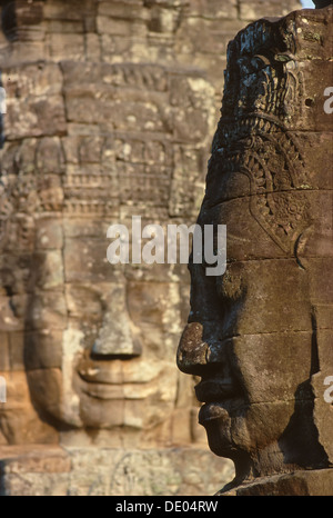 Stein-Gesichter geschnitzt in der Bayon, Teil von Angkor Thom, Siem Reap, Kambodscha Stockfoto