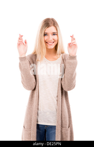 Schöne blonde Frau lächelnd und Kreuz Finger, isoliert auf weißem Hintergrund Stockfoto