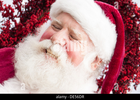 Santa ist unkontrolliert lachen. Stockfoto