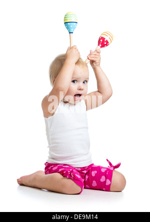 Lustige Kinder Mädchen spielen mit musikalische Spielzeuge. Isoliert auf weißem Hintergrund Stockfoto