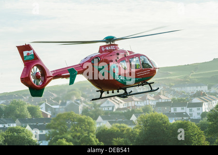 Wales Air Ambulance Service Hubschrauber abheben nach Abgabe eines Patienten ins Krankenhaus, Wales UK Stockfoto