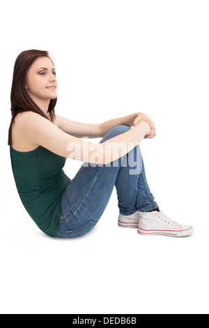 Nachdenklich attraktive Brünette sitzen Stockfoto