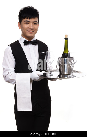 Kellner tragen Winebottle und Gläser Stockfoto