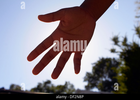 Hand vor der Kamera Stockfoto