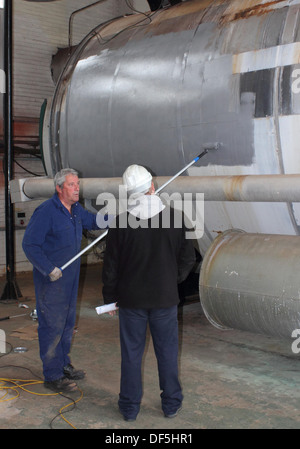 Malerei eine industrielle Dampfkessel Stockfoto