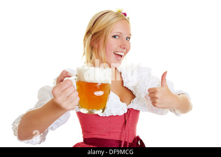 Glückliche Frau in ein Dirndl mit einem Krug Bier ihre Daumen hochhalten Stockfoto