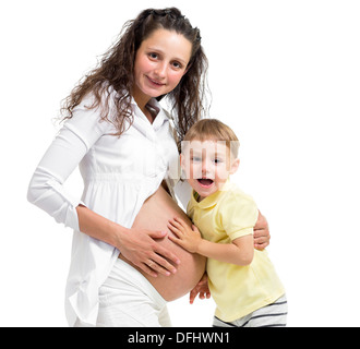 Kind junge berührt schwangere Mutter Bauch Stockfoto