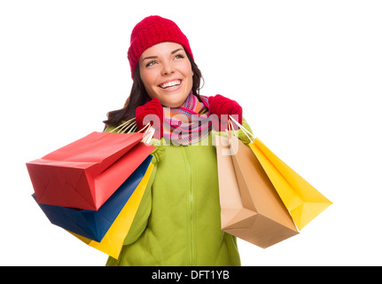 Wunderschöne Mischlinge Trägerin Winter Mütze und Handschuhe isoliert auf einem weißen Hintergrund Blick zur Seite. Stockfoto