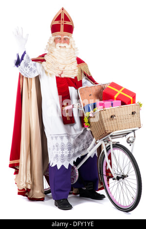 Sinterklaas auf einem Fahrrad, präsentiert gonna bringen den Kindern Stockfoto