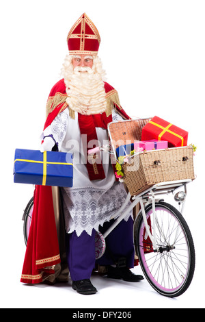 Sinterklaas auf einem Fahrrad, präsentiert gonna bringen den Kindern Stockfoto