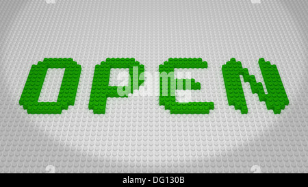 OFFENEN grünen Ziegel Formulierung gebaut auf weißen Grundplatte Stockfoto