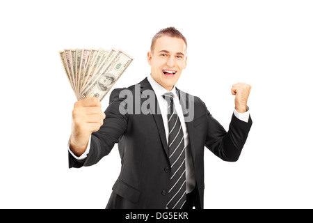 Aufgeregt Mann im Anzug hält US-Dollar und gestikulierte Glück isoliert auf weißem Hintergrund Stockfoto